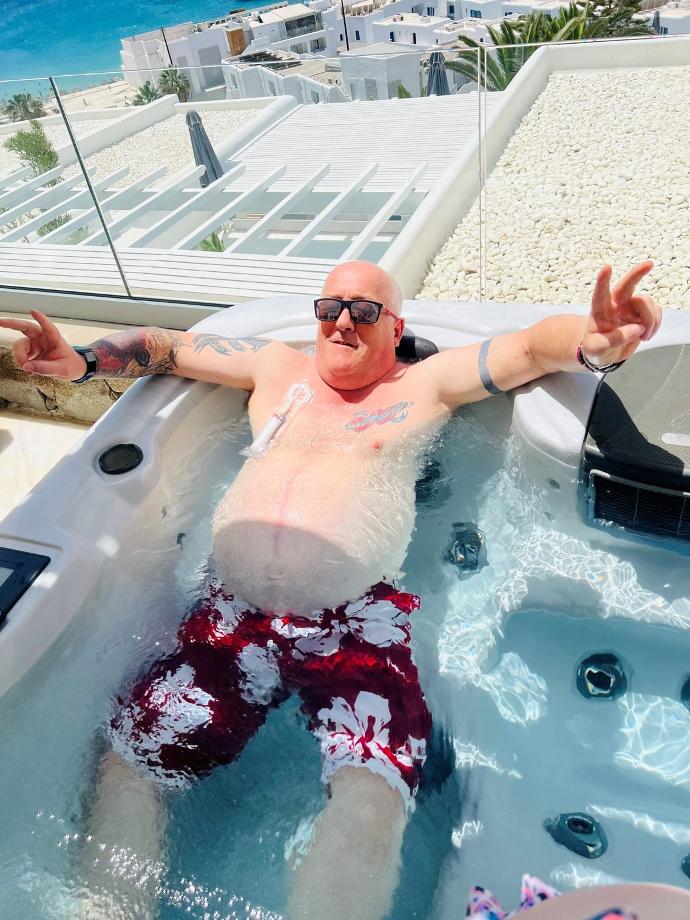 Simon relaxing in the hot tub with his Cath Dry
